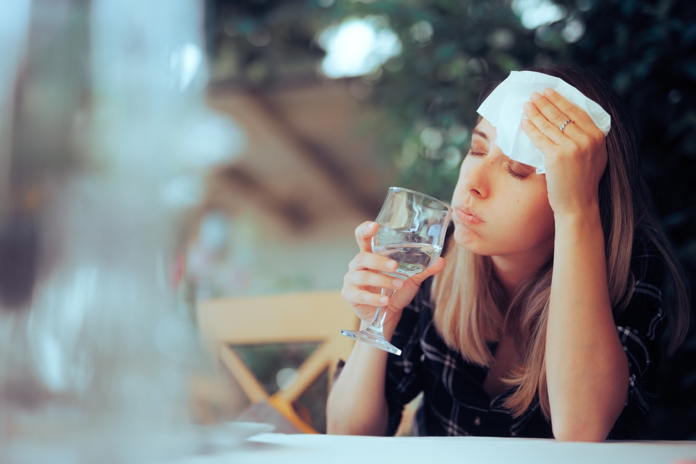 Dehydrated Woman Feeling Hot and Thirsty Drinking Water