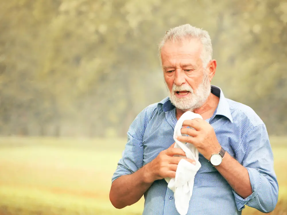 The old people were panting in the hot weather.