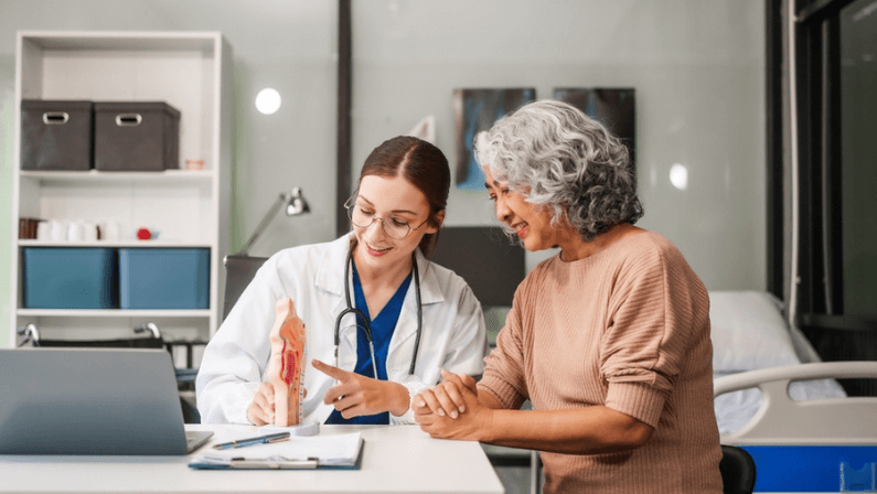 Caucasian woman and elderly Asian woman discuss health issues cold, influenza, pneumonia, bronchitis, stomach disease, GERD, IBS, inflammatory bowel disease, gallstones, chronic constipation