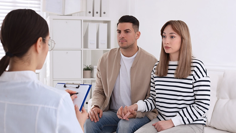 Couple having appointment with STD specialist in clinic