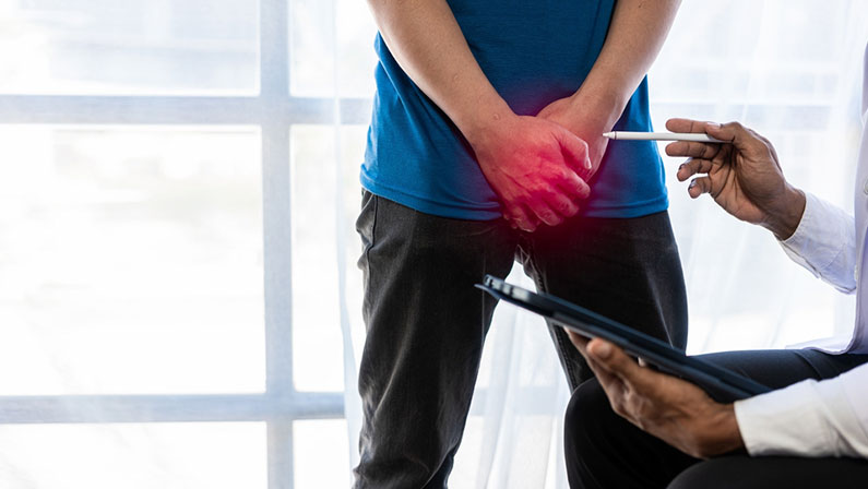 male patient sitting and consulting a doctor Prostate cancer problem Std Caucasian Man with his hand holding his crotch prostate inflammation erection problems