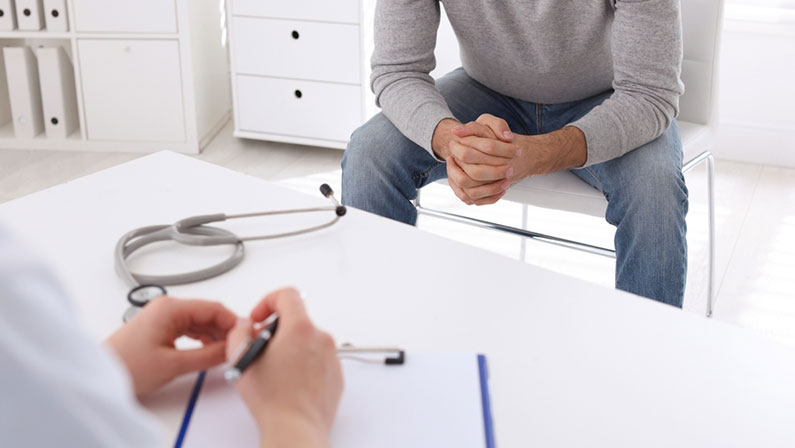 Man having appointment with STD specialist in clinic, closeup
