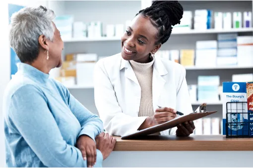 Female medicine professional helping a patient in a drugstore