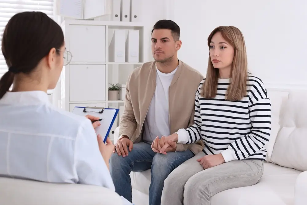 Couple having appointment with STD specialist in clinic
